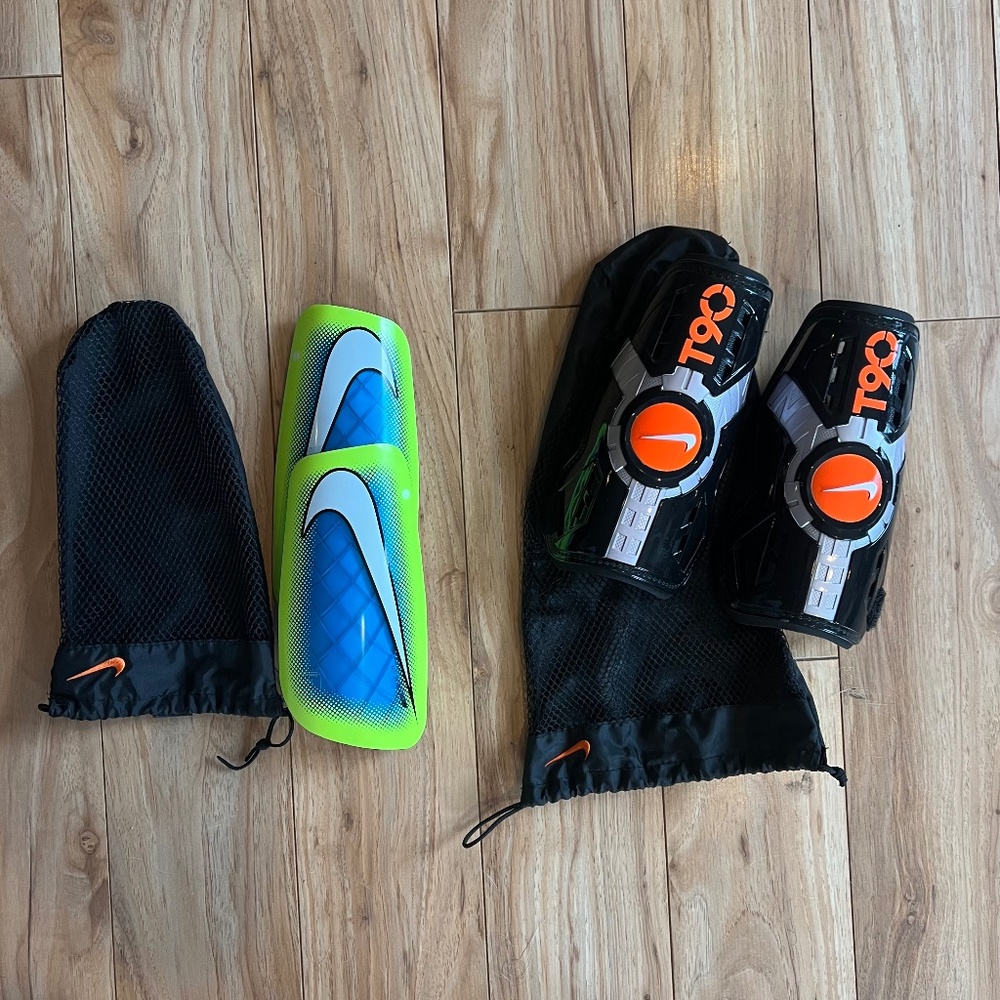 Two pairs of nike shin pads